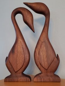 Two wooden geese facing each other