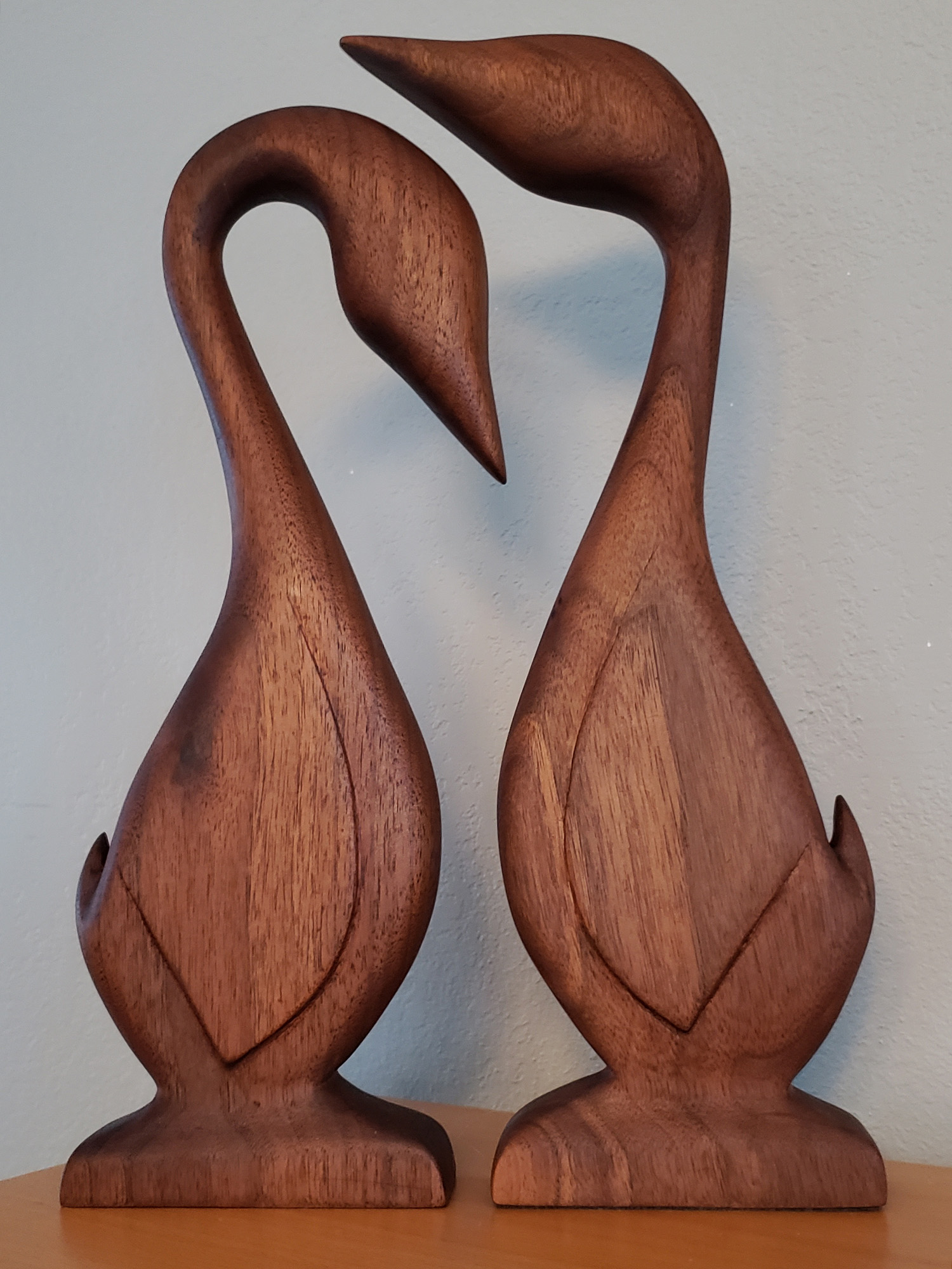 Two wooden geese facing each other