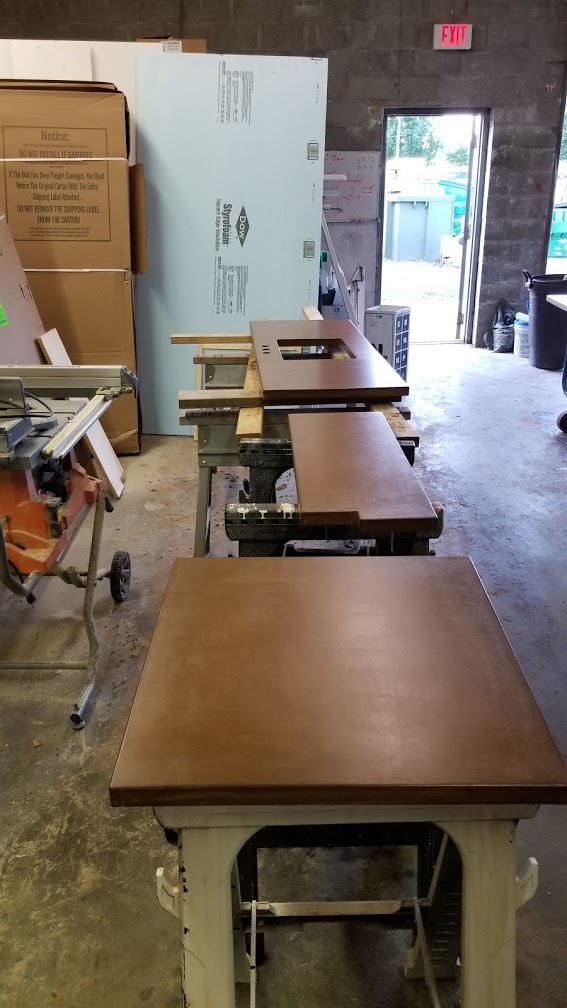 Saddle colored countertops during production in Blue Earth Studio.