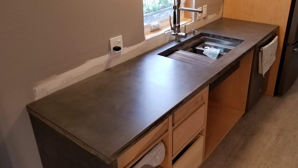 Concrete kitchen countertop installation; color: grayish-brown; finish: cream