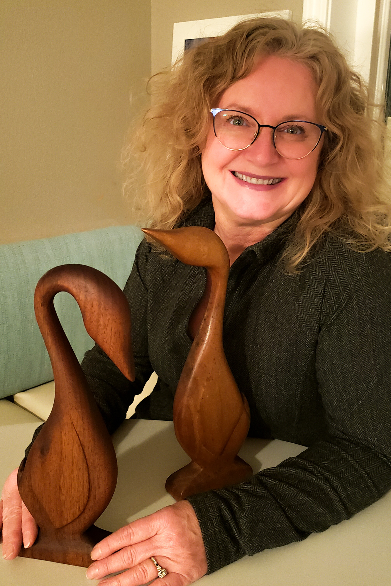 Kim with wooden geese started in Quincy High School shop class in 1979